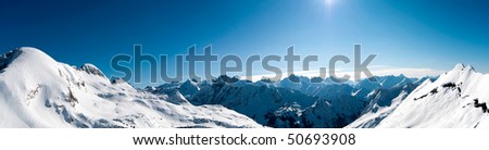 Snowy alpine landscape in sun - Southern germany