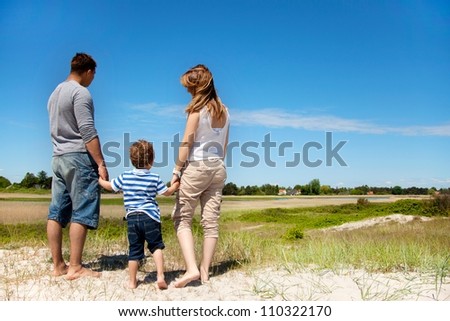 Young family looking and enjoying the beautiful landscape