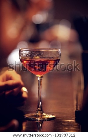Glass of sparkling red wine on the bar\'s counter