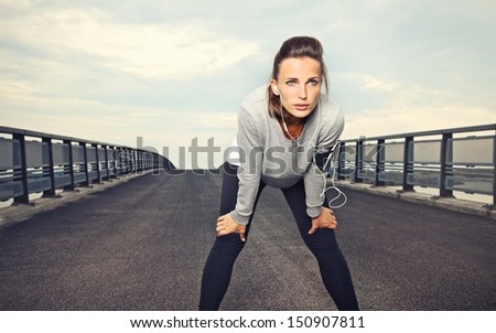 Female runner with focus and determination to run