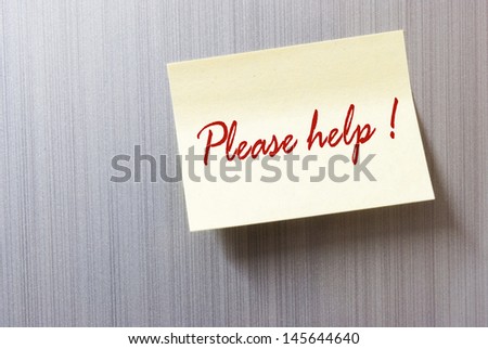 please help written on a yellow sticky note paper and stuck on to a metallic grunge patterned background