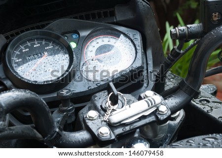motor bike odometer fuel meter tachometer and ignition with dew droplets