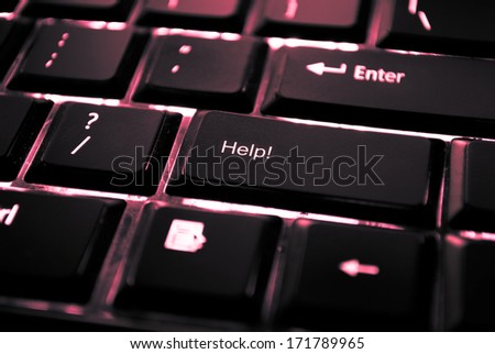 image of a backlit keyboard with help written on a key