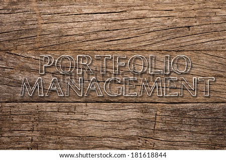 Portfolio Management written on Wooden Background