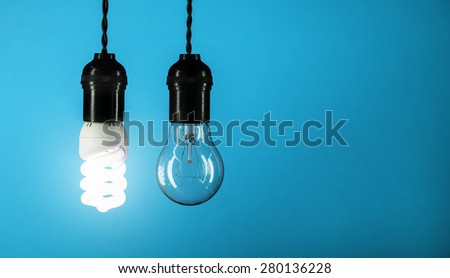 Energy saving concept of bulb over blue background
