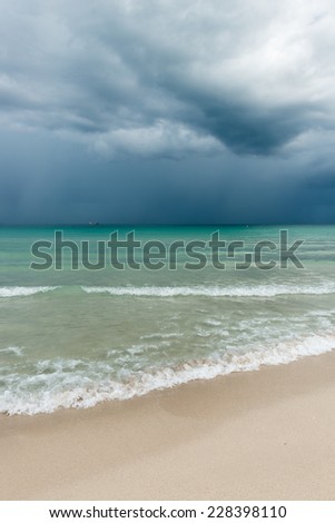 Storm over Miami Beach.  Ocean water surface under cloudy sky. Great impression of distance and solitude