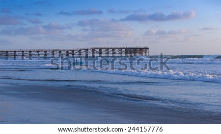 California coast. San Diego beach at sunset. Ocean Waves rolled on the sand