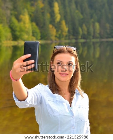 Beautiful woman taken picture of herself, selfie
