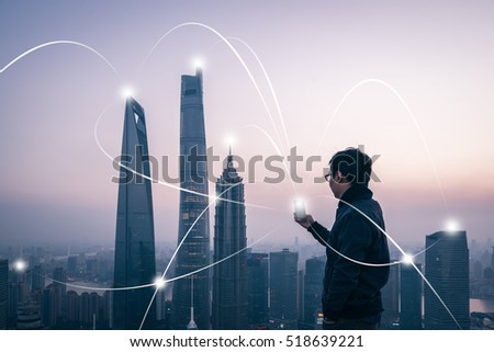 man using smart phone with city network connection technology