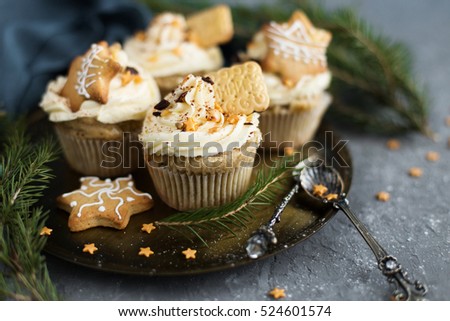 Cupcakes in Christmas style with biscuits and chocolate
