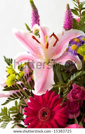 Lilly floral arrangement shot in the studio against white.
