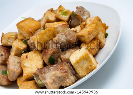 Fried tofu and pork ribs, a homemade food, made from pork rib and tofu, eat with rice as main dish