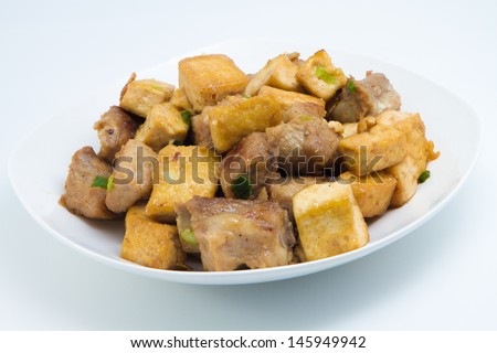 Fried tofu and pork ribs, a homemade food, made from pork rib and tofu, eat with rice as main dish