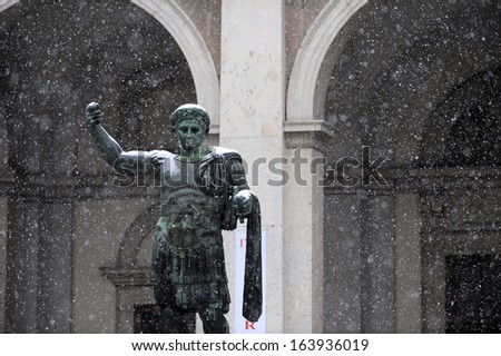 Snowing on the statue of Roman Emperor Marco Aurelio in Milan