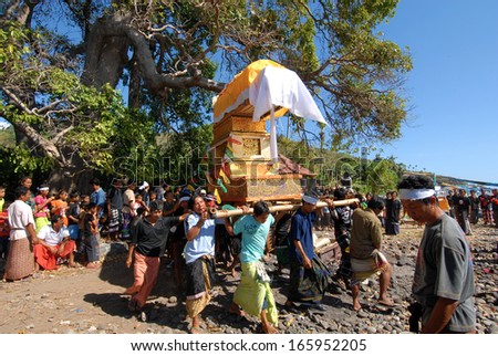 BALI, INDONESIA - FEBRUARY,12: People carrying a coffin to cremation, on February,12, 2005 in Bali, Indonesia.