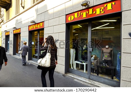 Milan, Italy - September 26: People Walk By An Outlet Clothes Shop Of Milan, Italy. September, 26 2008.