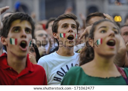 Milan, Italy - June 28: Italian Fans Watching On An Outside Wide Screen The Soccer Semi-Final Of The 2012 European Soccer Cup Between Italy And Germany. Milan, June 28, 2012.