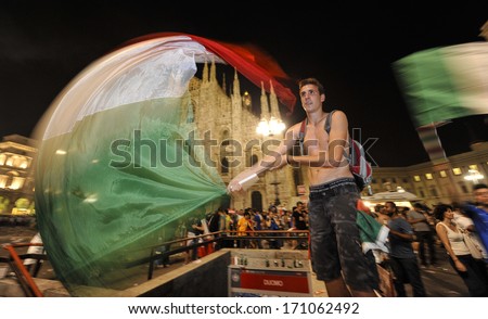 MILAN, ITALY - JUNE 28: Italian fans celebrating after Italy won with Germany at the semi-final of the 2012 European Soccer Cup. Milan, June 28, 2012.