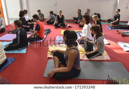 MILAN, ITALY - October 14: Yoga group lesson during a Yoga Festival in Milan October 14, 2012.