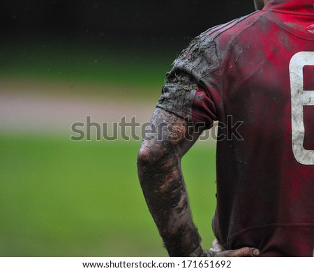 MILAN, ITALY - OCTOBER 28: Amateur rugby league in Milan, October 28,2010. Player muddy arm during the match between A.S.R. Rugby Milano vs Biella Rugby Club.