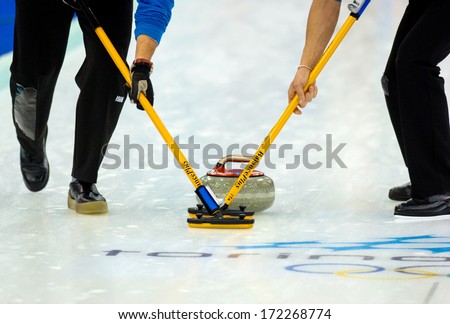 TURIN, ITALY - MARCH 28: players during a Curling match of the Winter Olympic Games in Turin, March 28, 2006.