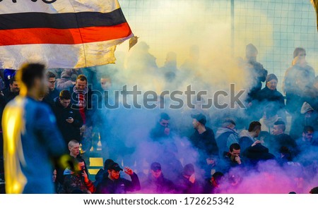 MILAN, ITALY - JANUARY 12: AC Milan ultras soccer fans fire smoke bombs to celebrate a goal during a Youth League in Milan January 12, 2014.