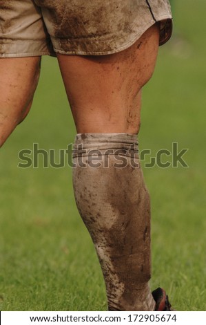PARMA, ITALY - OCTOBER 12: Close up of rugby player muddy leg  during the Italian Rugby League match Parma vs Treviso, in Parma, October 12, 2005.