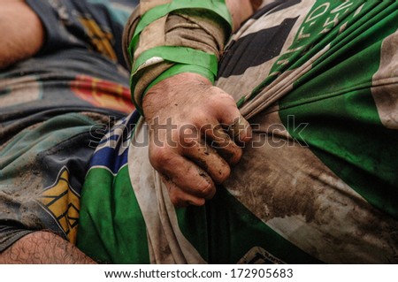 Parma, Italy - October 12: Close Up Of Rugby Players Arm Pushing In A Scrum During The Italian Rugby League Match Parma Vs Treviso, In Parma, October 12, 2005.