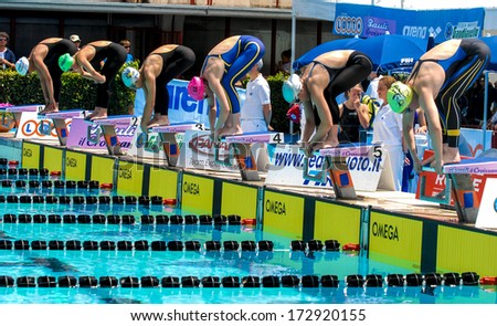 ROME ITALY - JUNE 14: Swimmers women ready at the starting blocks during a swimming race of the International Swimming Championship \