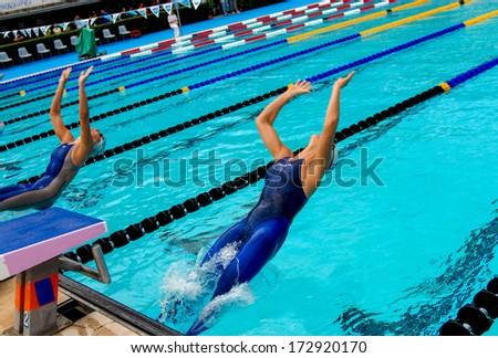 ROME ITALY - JUNE 14: Swimmers women starting from the blocks during a backstoke swimming race of the International Swimming Championship \