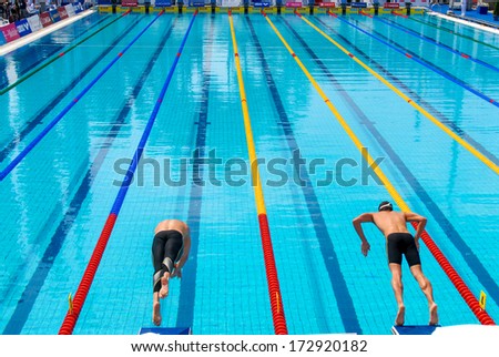 ROME ITALY - AUGUST 25: Swimmers diving into water during a swimming race of the International Swimming Championship \