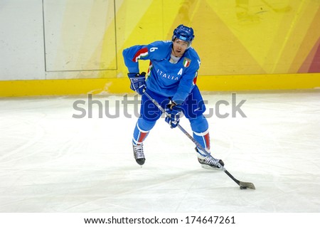 TURIN, ITALY-FEBRUARY 18, 2006: Italian player during the Male Ice Hockey match Italy vs Germany at the Winter Olympic Games of Turin 2006.