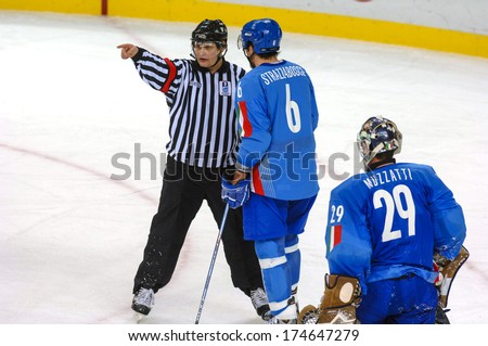 TURIN, ITALY-FEBRUARY 18, 2006: Referee pointing during the Male Ice Hockey match Italy vs Germany at the Winter Olympic Games of Turin 2006.