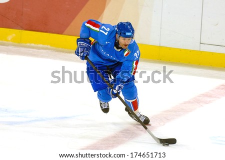 TURIN, ITALY-FEBRUARY 18, 2006: Italian player during the Male Ice Hockey match Italy vs Germany, at the Winter Olympic Games of Turin 2006.