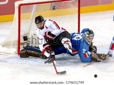 TURIN, ITALY-FEBRUARY 13, 2006: Male Ice Hockey match Italy vs Germany, at the Winter Olympic Games of Turin 2006.
