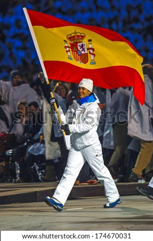 TURIN, ITALY-FEBRUARY 11, 2006: Spanish flag holder enters at the stadium during the opening ceremony of the Winter Olympic Games of Turin 2006.