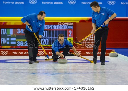 Turin, Italy-February 19, 2006: Italian Male Team In Action During The Winter Olympic Games Of Turin 2006.