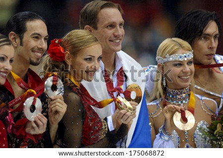 TURIN, ITALY-FEBRUARY 21, 2006: Medals Ceremony podium of the Couple Figure Ice Skating\'s final during the Winter Olympic Games of Turin 2006.
