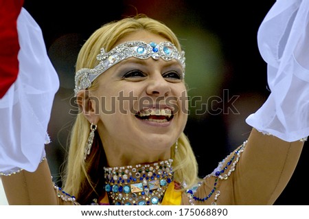 TURIN, ITALY-FEBRUARY 21, 2006: Elena Grushina at the medals ceremonyof the Couple Figure Ice Skating's final during the Winter Olympic Games of Turin 2006.
