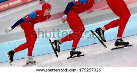 TURIN, ITALY-FEBRUARY 17, 2006: Team competing during the Speed Ice Skating competition of the Winter Olympic Games of Turin 2006.