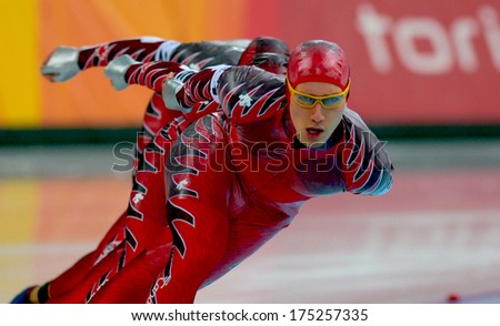 Turin, Italy-February 17, 2006: Canadian Team Competing During The Speed Ice Skating Competition Of The Winter Olympic Games Of Turin 2006.