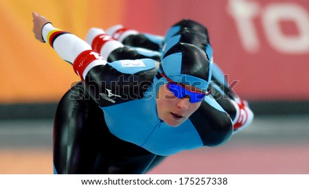 TURIN, ITALY-FEBRUARY 17, 2006: German team competing during the Speed Ice Skating competition of the Winter Olympic Games of Turin 2006.