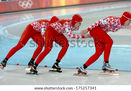 Turin, Italy-February 17, 2006: Russian Team Competing During The Speed Ice Skating Competition Of The Winter Olympic Games Of Turin 2006.