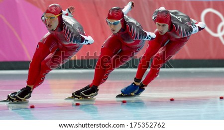 Turin, Italy-February 17, 2006: Canadian Team Competing On The Speed Ice Skating Competition During The Winter Olympic Games Of Turin 2006.