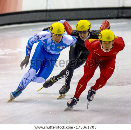 TURIN, ITALY FEBRUARY 16, 2006: Athletes group during the Short Track competition at the Winter Olympic Games of Turin 2006.