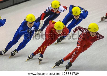 TURIN, ITALY FEBRUARY 19, 2006: Athletes group during the Short Track competition at the Winter Olympic Games of Turin 2006.