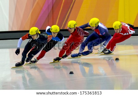 Turin, Italy February 13, 2006: Athletes Group During The Short Track Competition At The Winter Olympic Games Of Turin 2006.