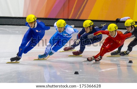 TURIN, ITALY FEBRUARY 13, 2006: Athletes group during the Short Track competition at the Winter Olympic Games of Turin 2006.