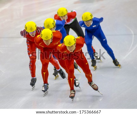 TURIN, ITALY FEBRUARY 08, 2006: Athletes group during the Short Track competition at the Winter Olympic Games of Turin 2006.