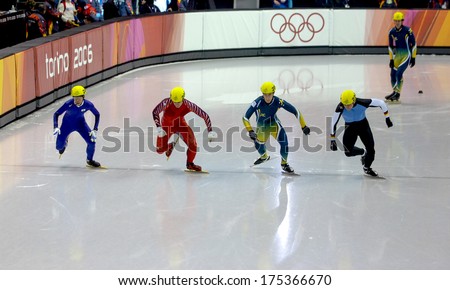 TURIN, ITALY FEBRUARY 16, 2006: Athletes group starting during the Short Track competition at the Winter Olympic Games of Turin 2006.